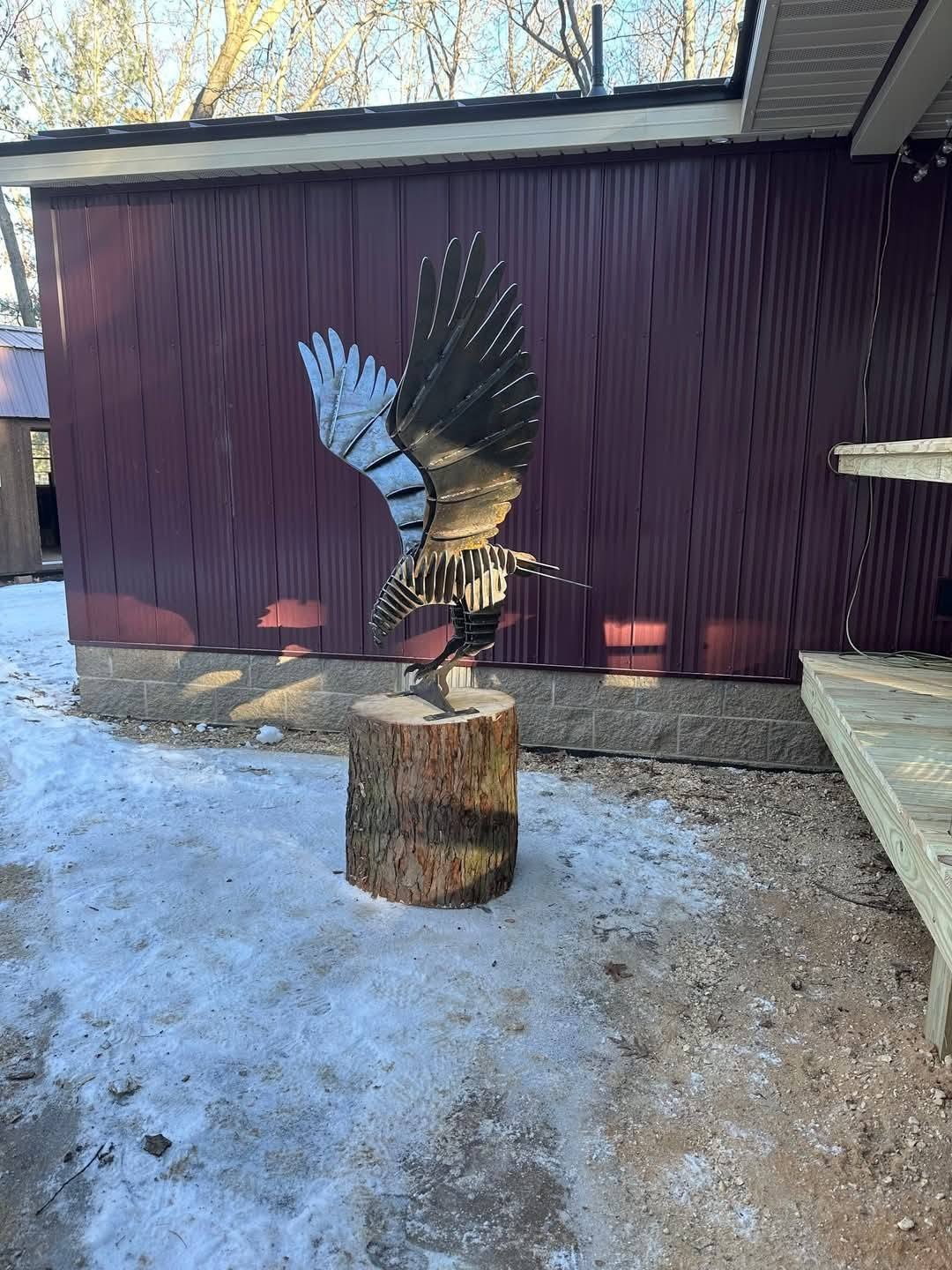 Eagle beside the porch in winter