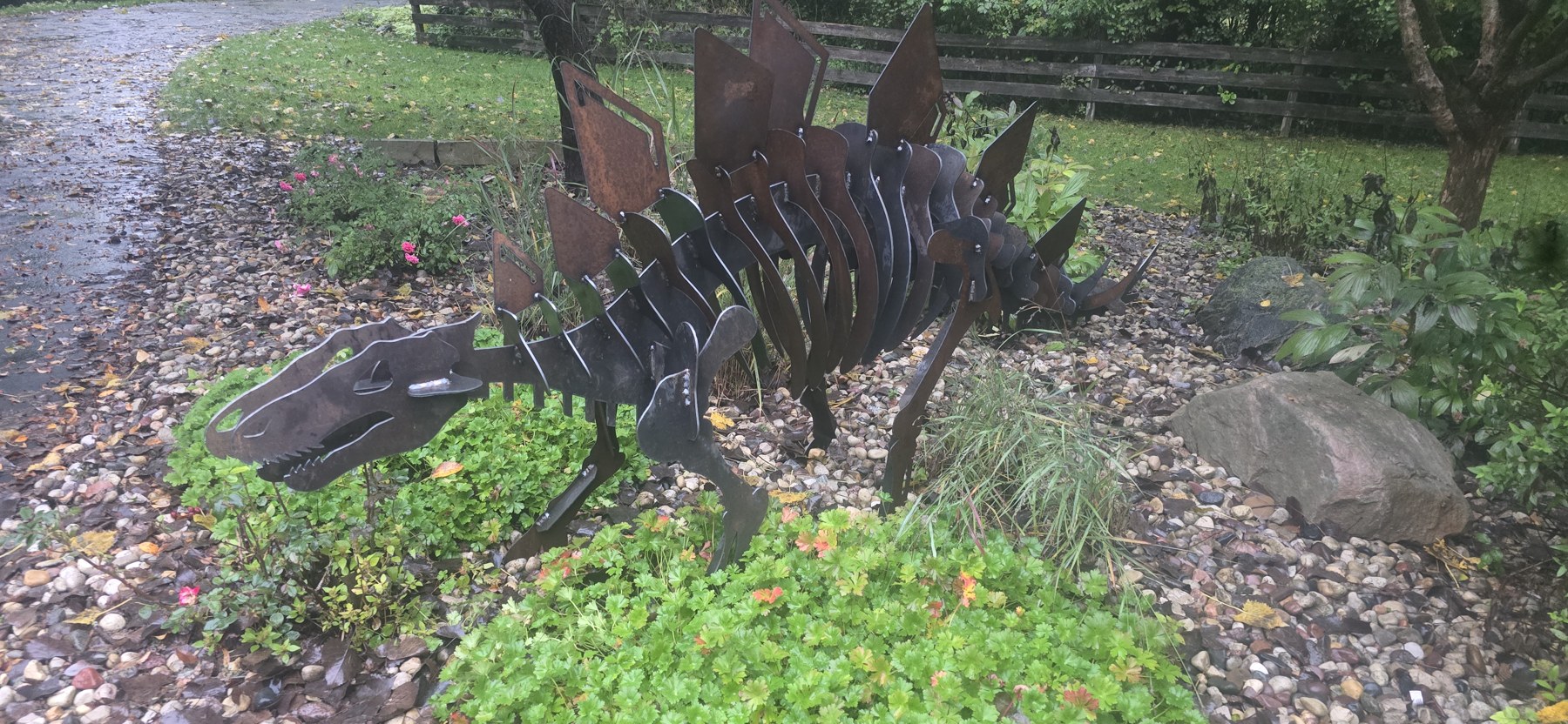 Stegosaurus among the garden plants